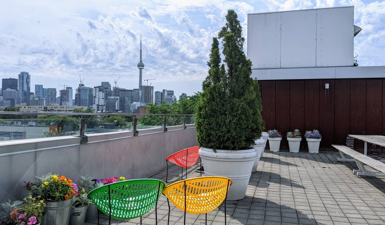 Rooftop terrace with views of the CN Tower and downtown Toronto at Planet Traveler Hostel in Toronto, Canada