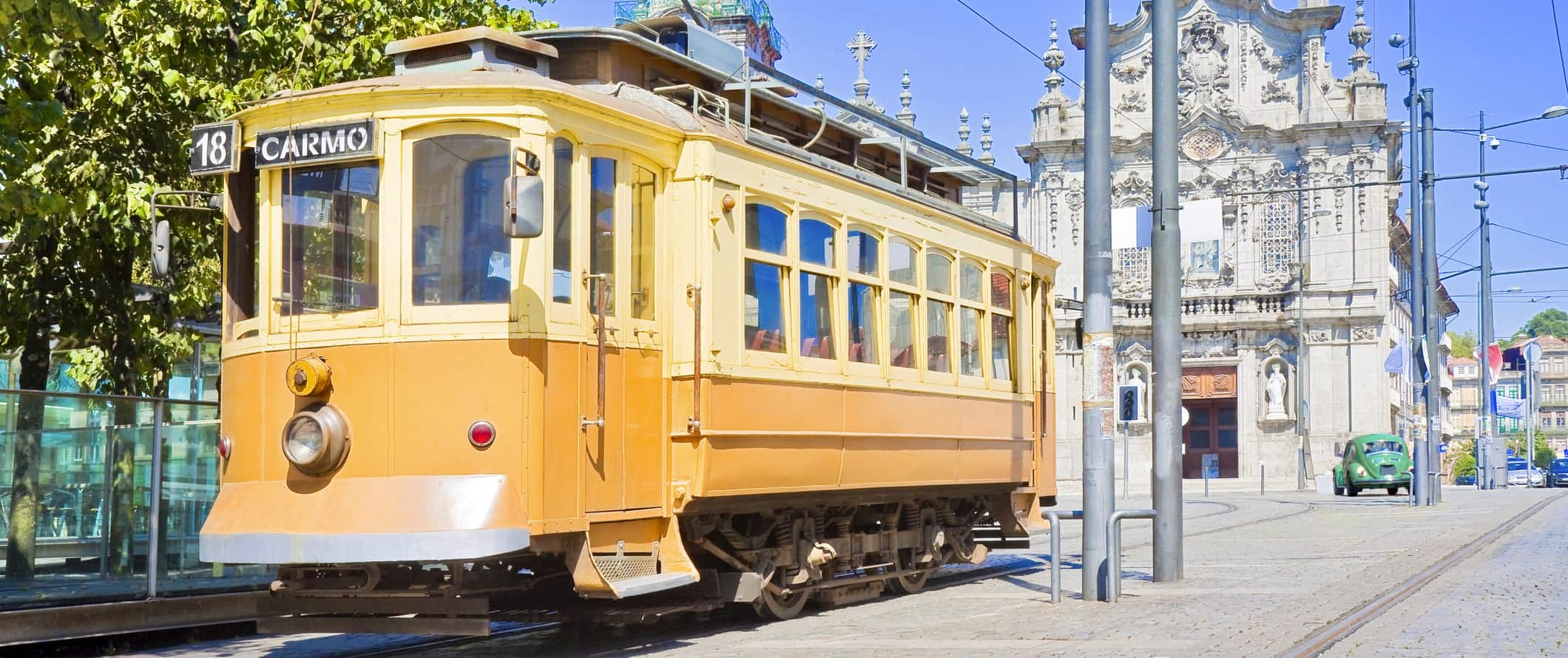 The classic yellow street car on a sunny day in Porto, Portugal
