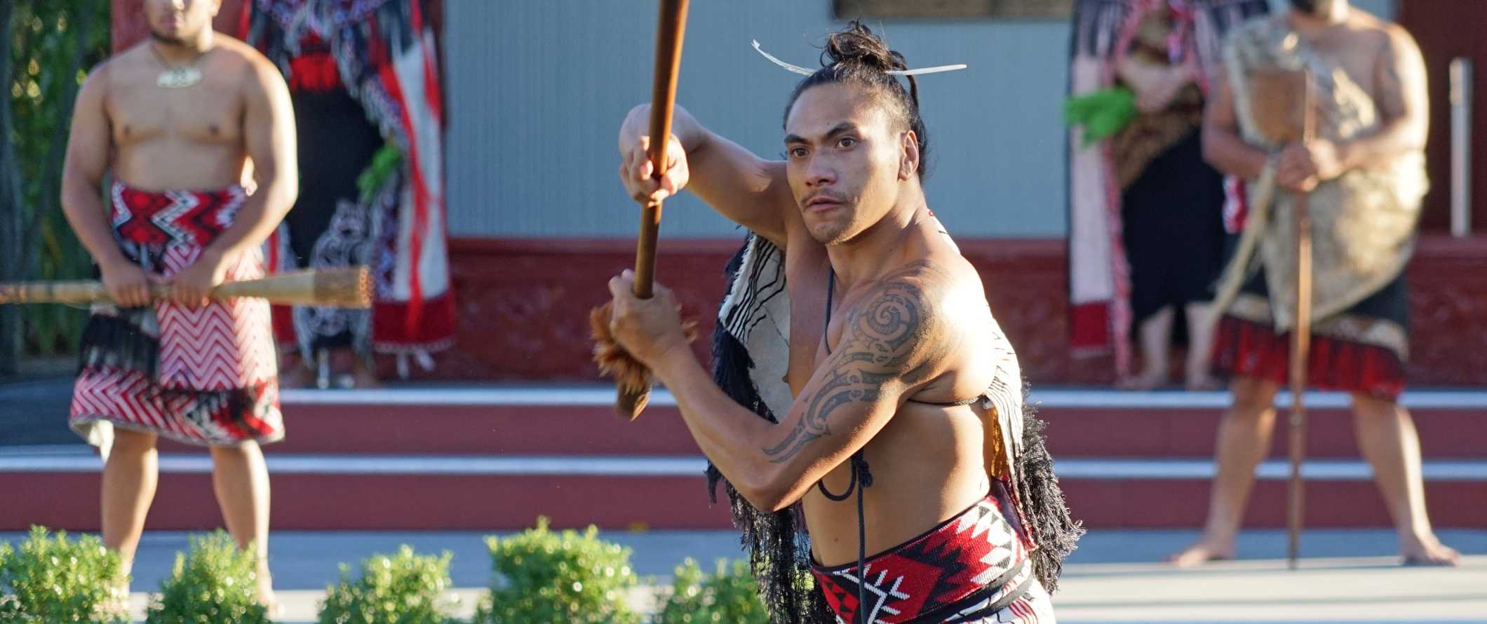 A Maori man performing a traditional dance in Rotorua, New Zealand.