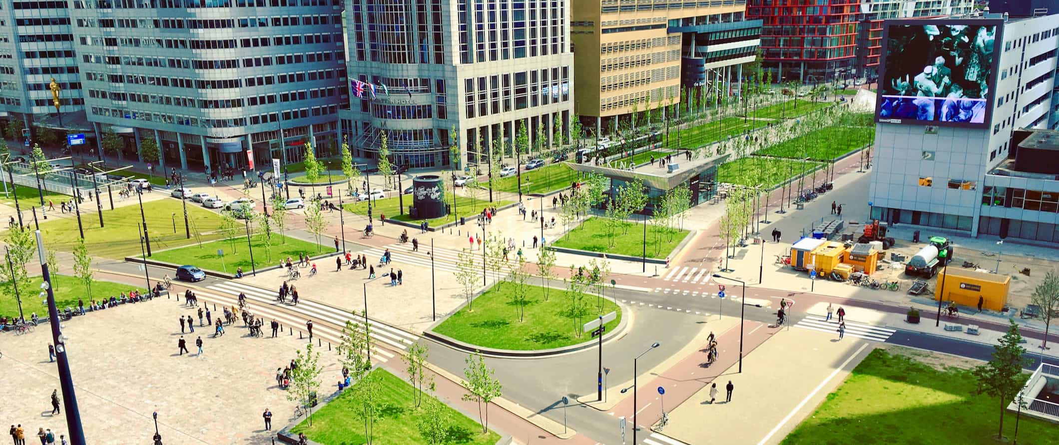 A busy transit station on a sunny summer day in Rotterdam, Netherlands