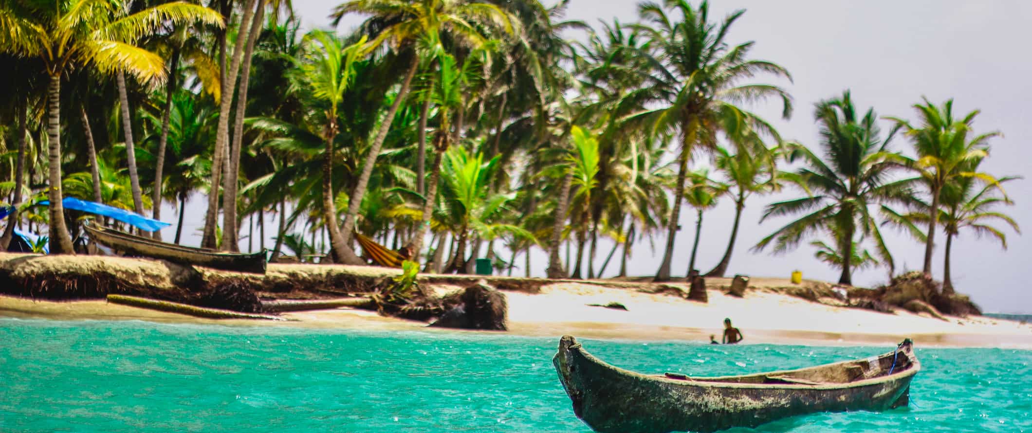 A boat along the beautiful shores of the San Blas Islands in Panama