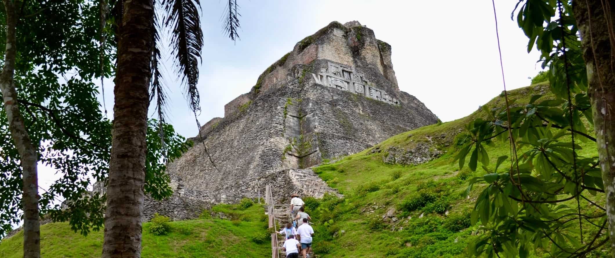 People walking up steep stairs heading up to Xunantunich, Mayan ruins in San Ignacio, Belize