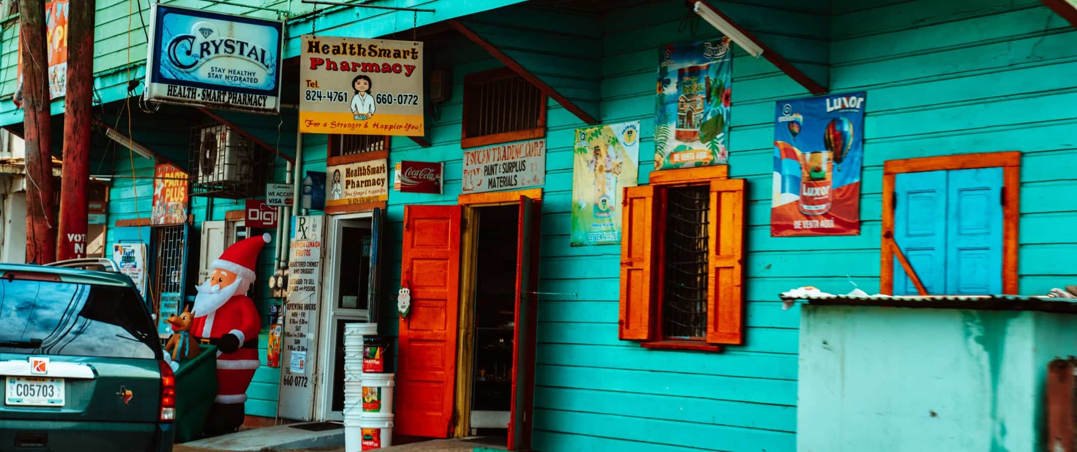 Turquoise shop with red doors in San Ignacio, Belize