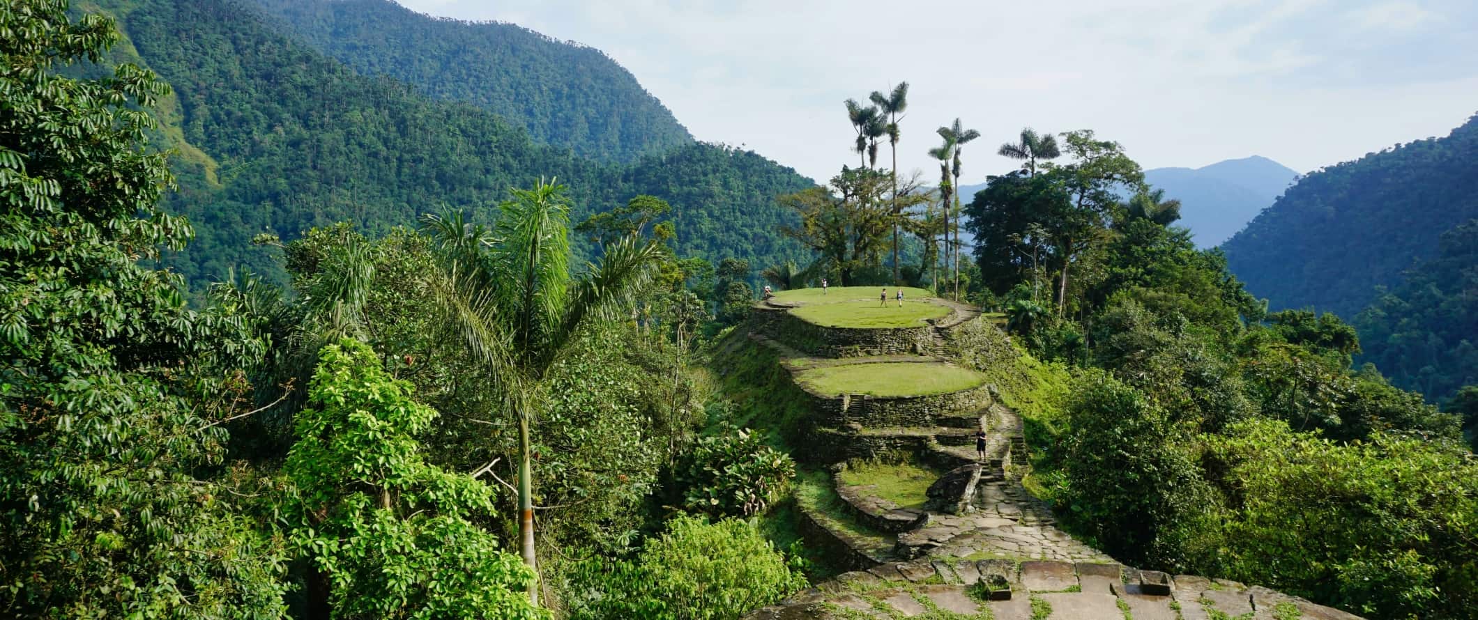 People walking around on the ruined Ciudad Perdida in the rainforest of Colombia