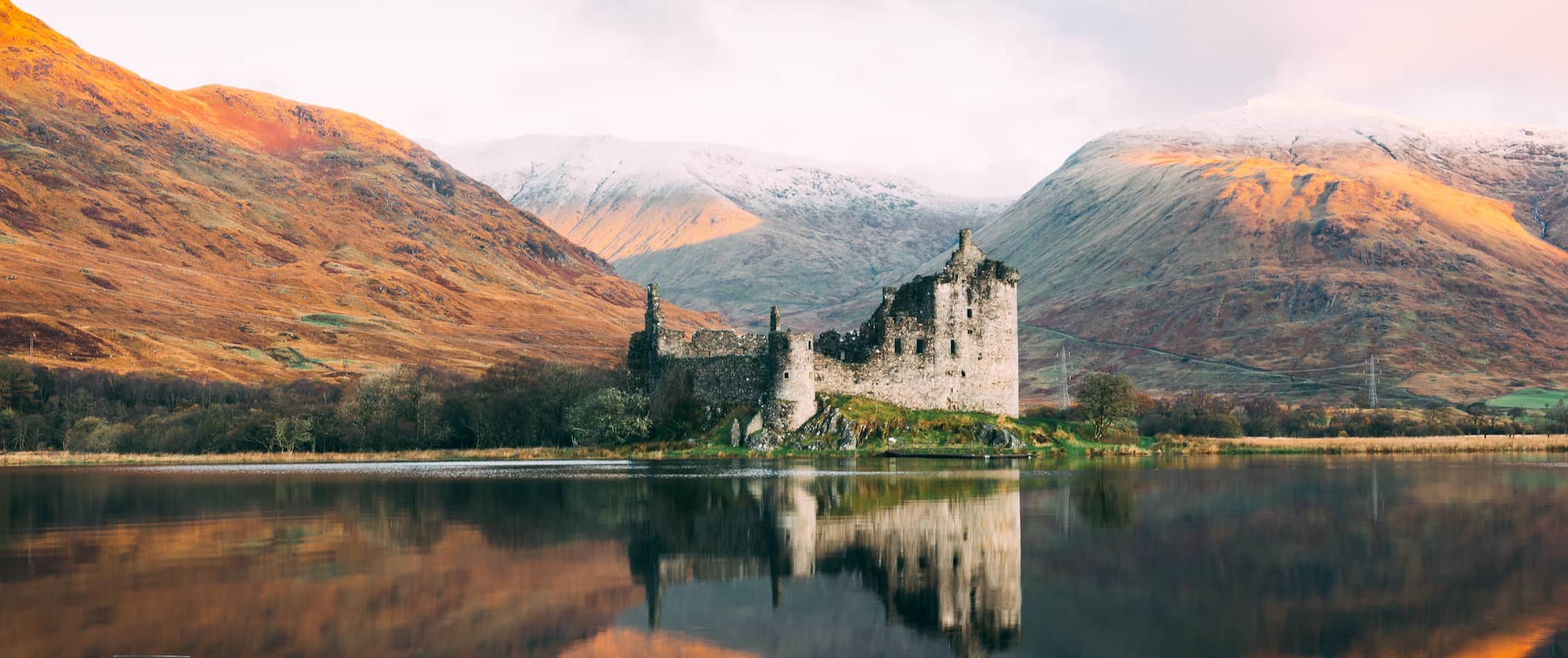 A historic castle in Scotland near the water in the highlands