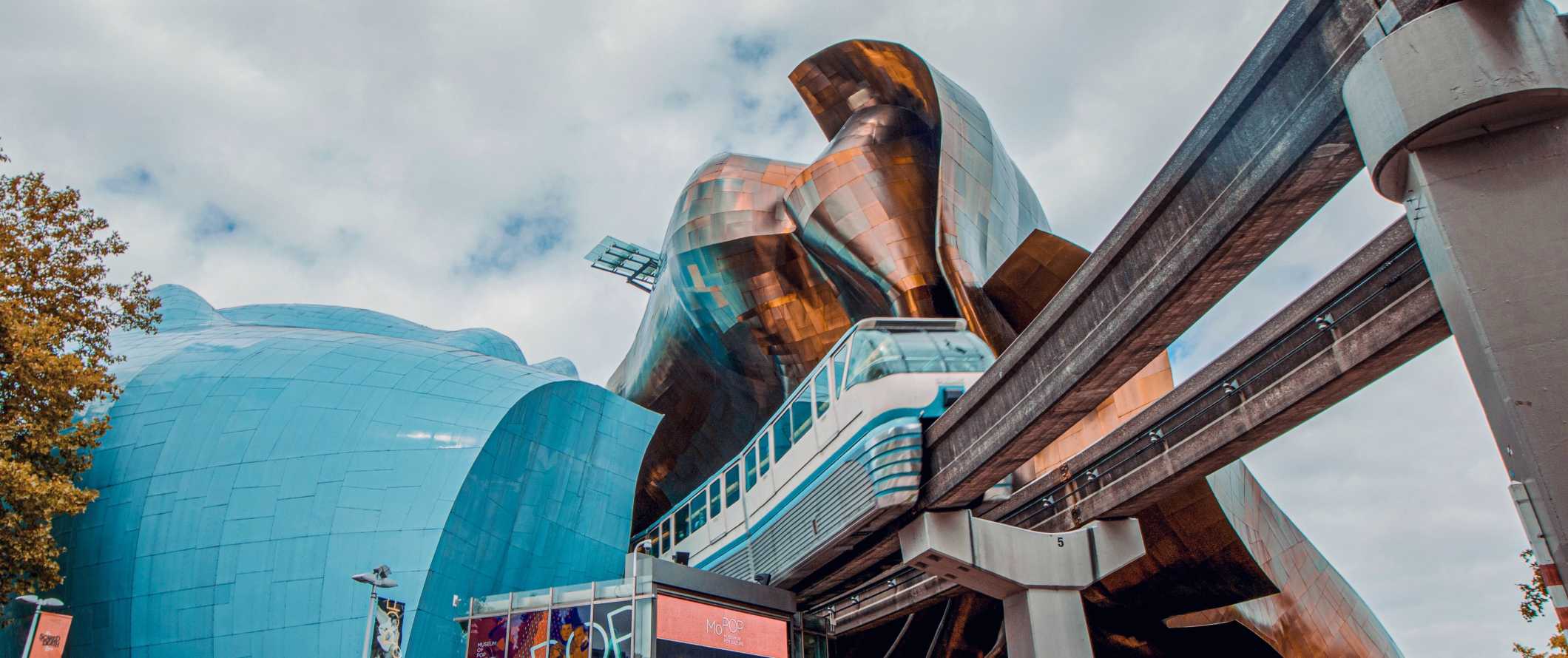 Monorail passing by the Frank Gehry-designed Museum of Pop Culture in Seattle, Washington.