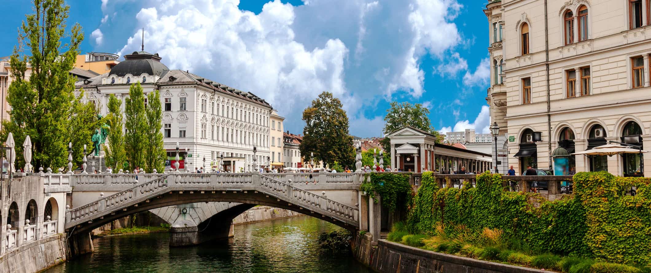 The historic buildings of Ljubljana along the canal in Slovenia on a sunny day