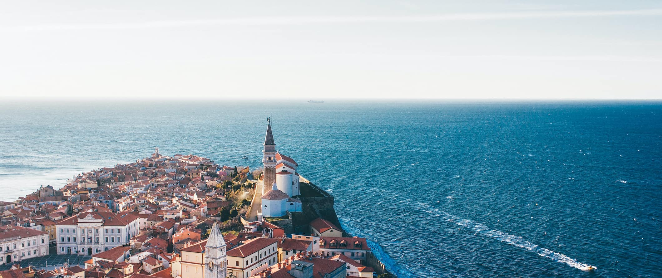 The beautiful sea-side town of Piran along the coast of Slovenia on a bright summer day