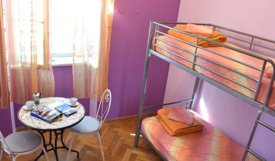 The interior of a small dorm with bunk beds in the Old Town Hostel in Split, Croatia