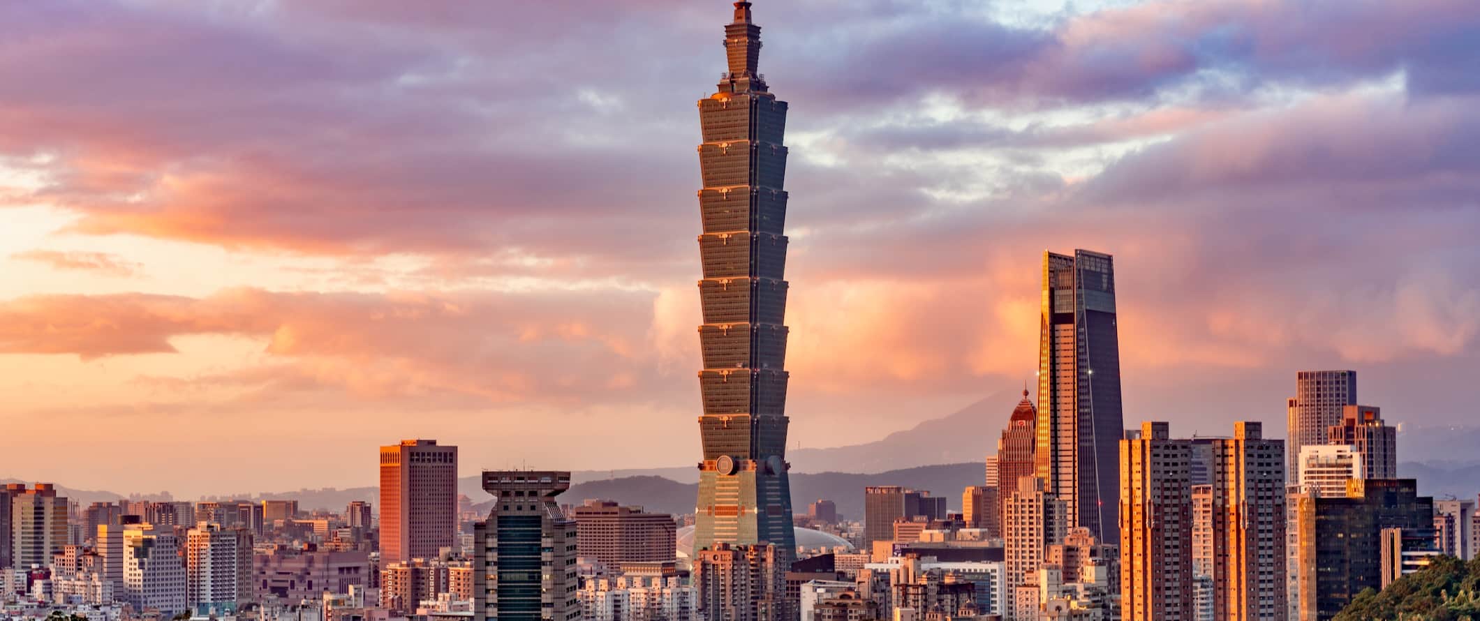 The towering skyline of Taipei, Taiwan featuring Taipei 101 during the sunset