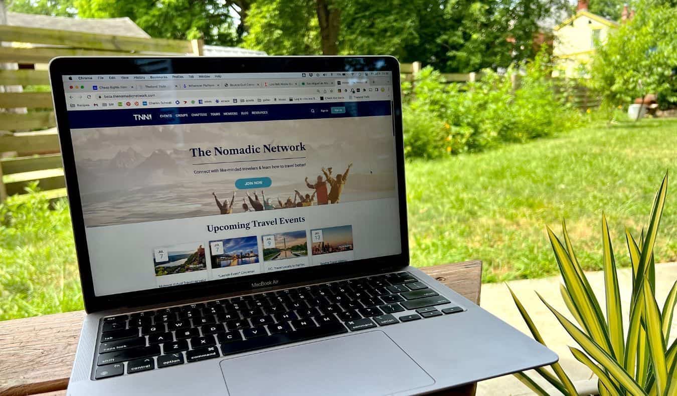 A laptop on an outdoor table featuring the new TNN website homepage