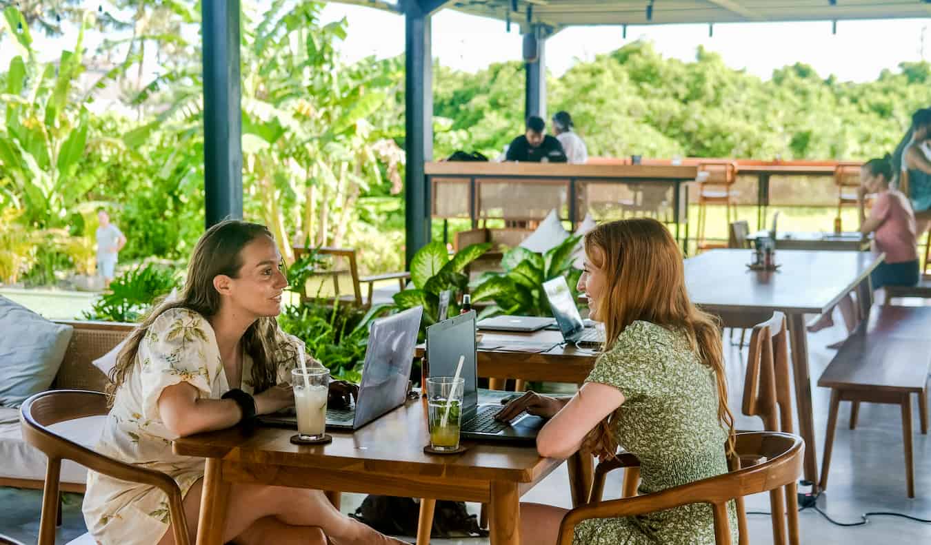 Two girls chatting and hanging out at the Tribal Bali hostel