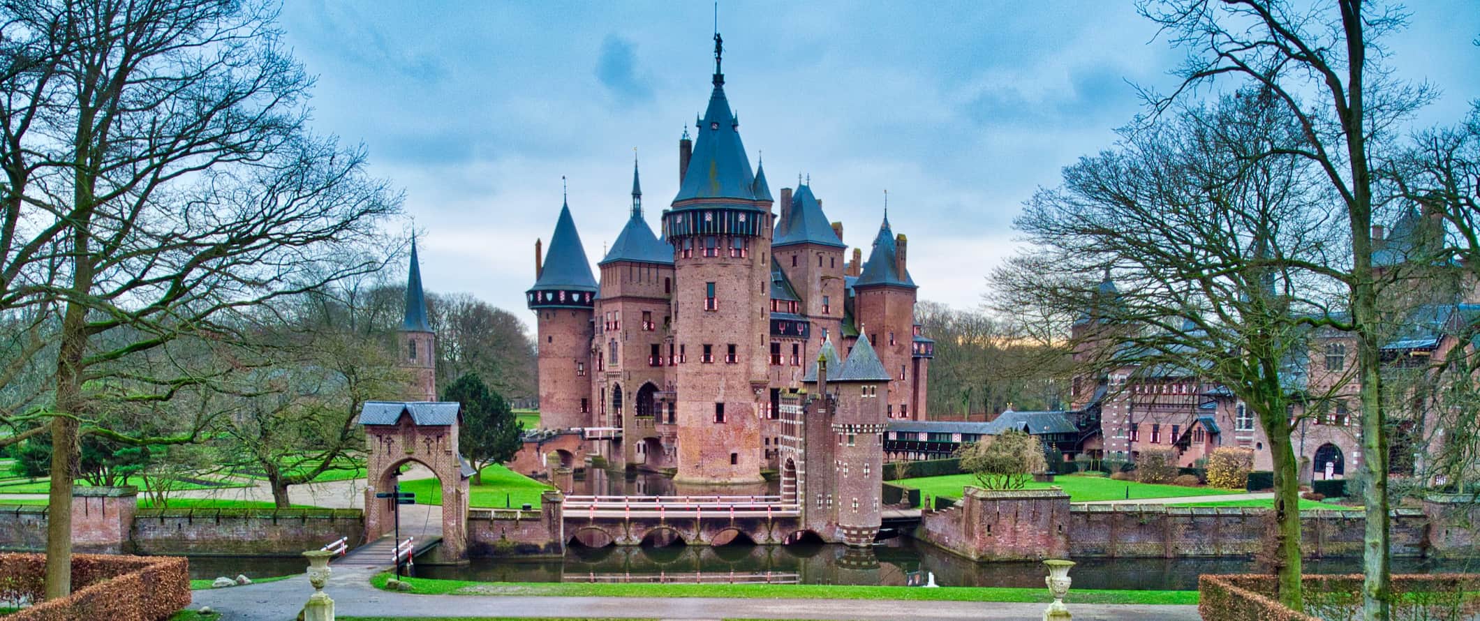 A towering stone manor house with a tall tower in Utrecht, Netherlands