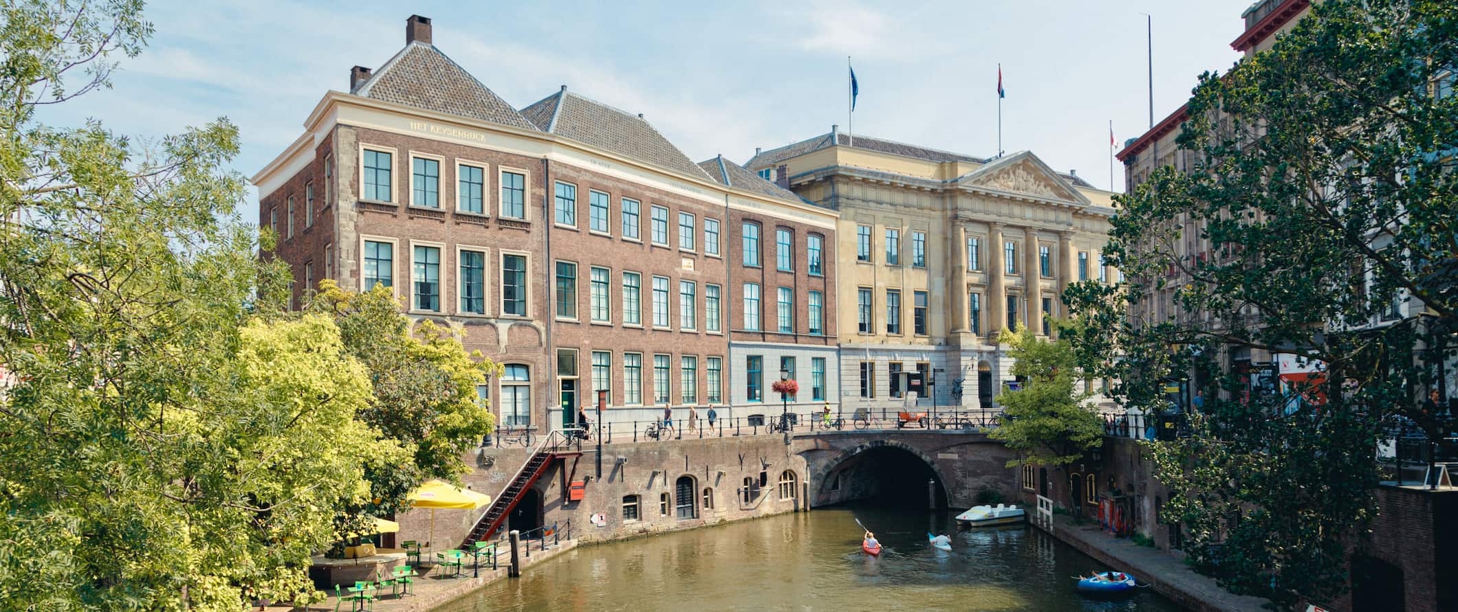 A view of a narrow, winding canal in Utrecht, Netherlands