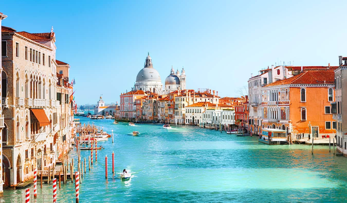 Aerial view of Venice, Italy with boats floating down the canals.