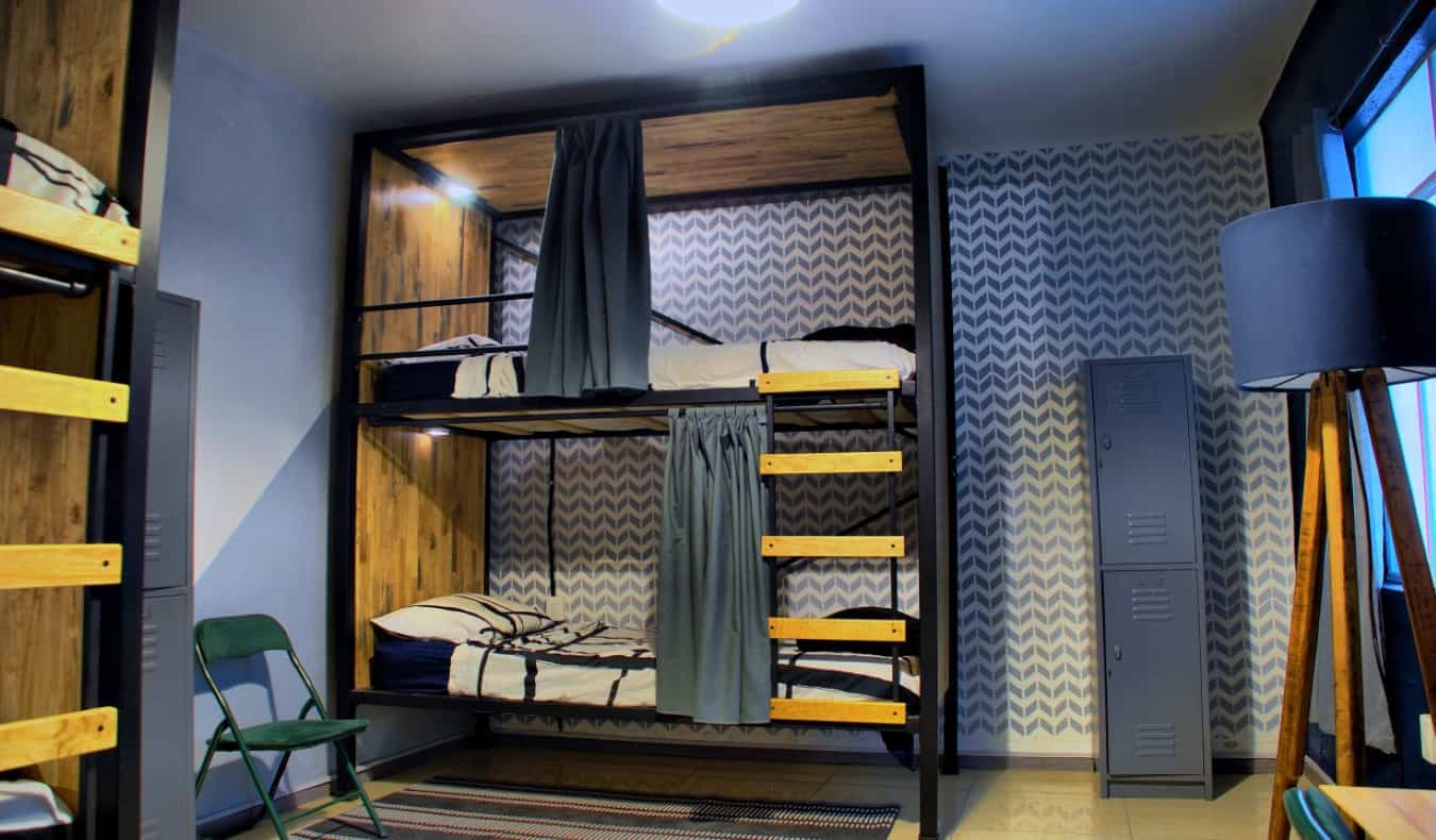 Modern wood bunk beds in dorm room at Wanderlust District in Mexico City