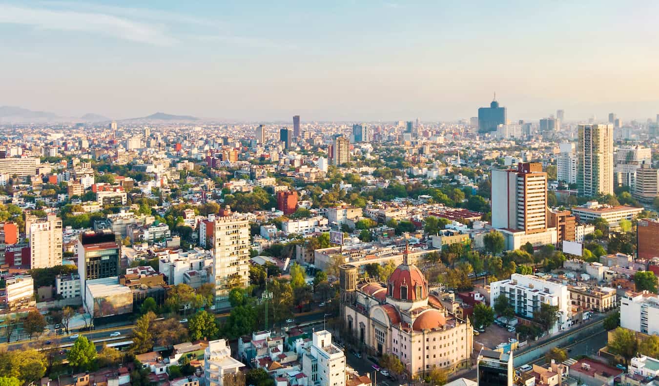 Skyline of Mexico City, Mexico and its tall skyscrapers and lush greenery
