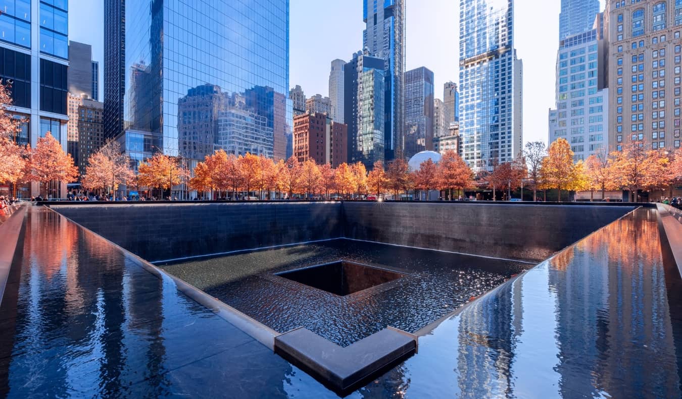 The water feature of the 9/11 Memorial surrounded by trees in New York City