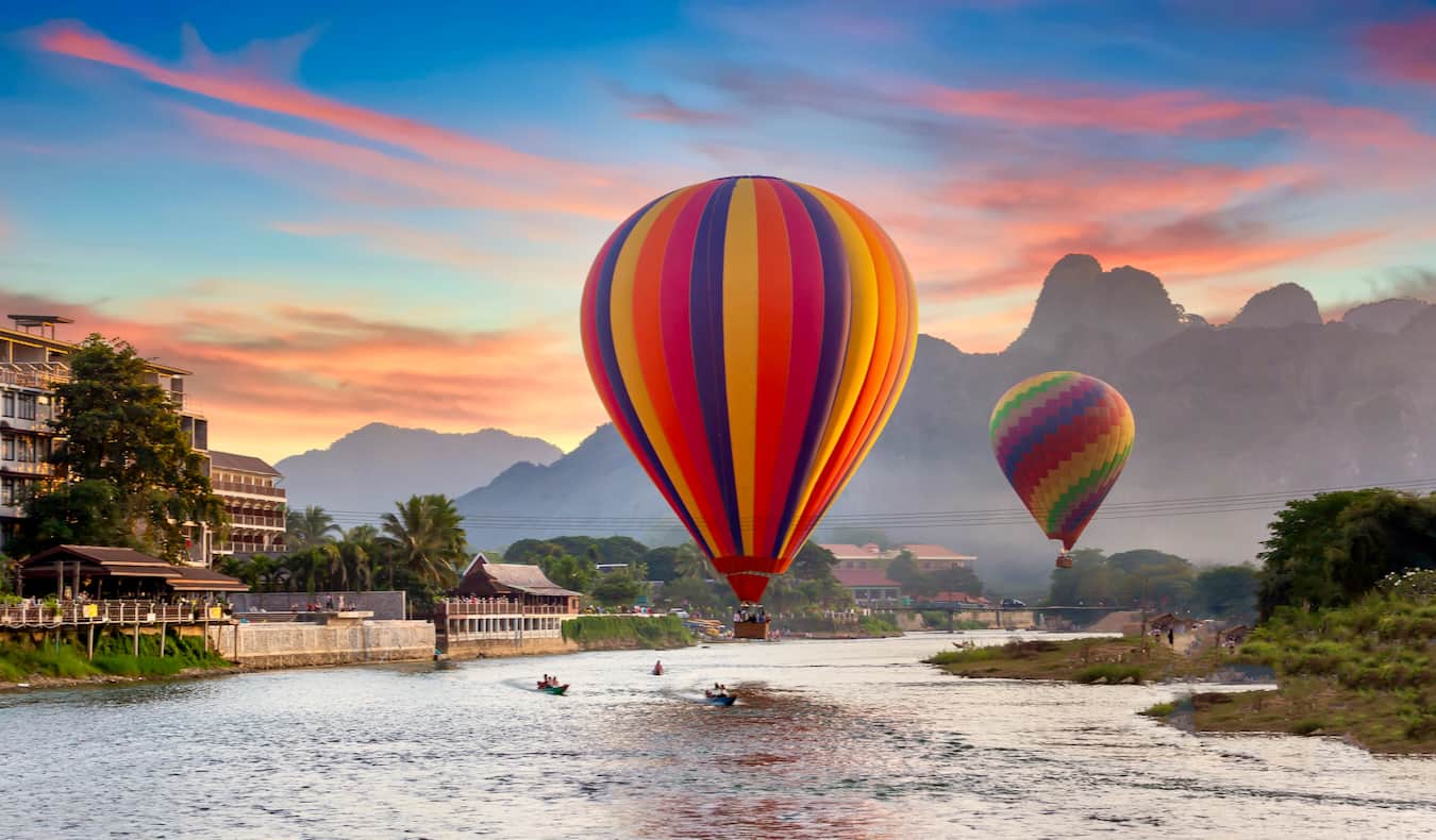 The beautiful hot air balloons over the Vang Vieng river in Laos