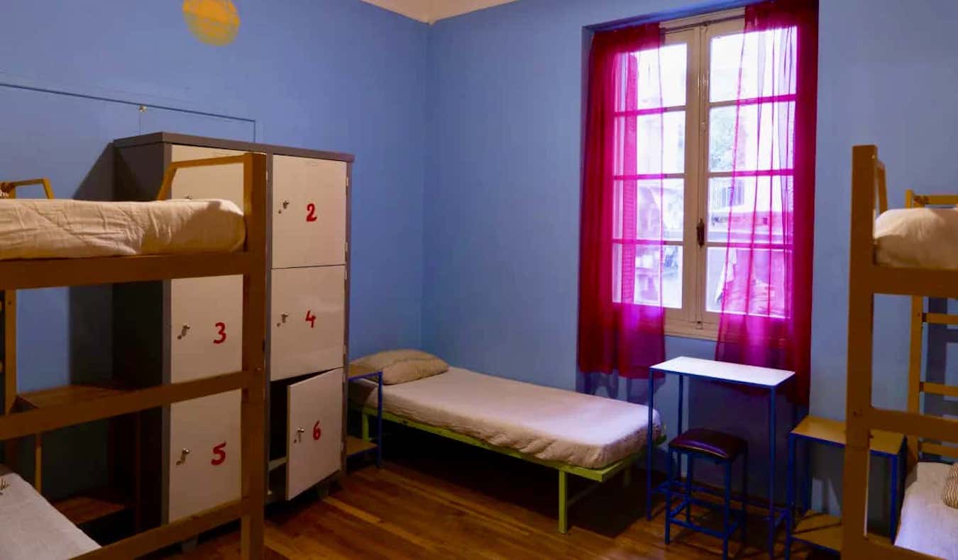 Small dorm room with lockers at the Pagration Youth Hostel in Athens, Greece