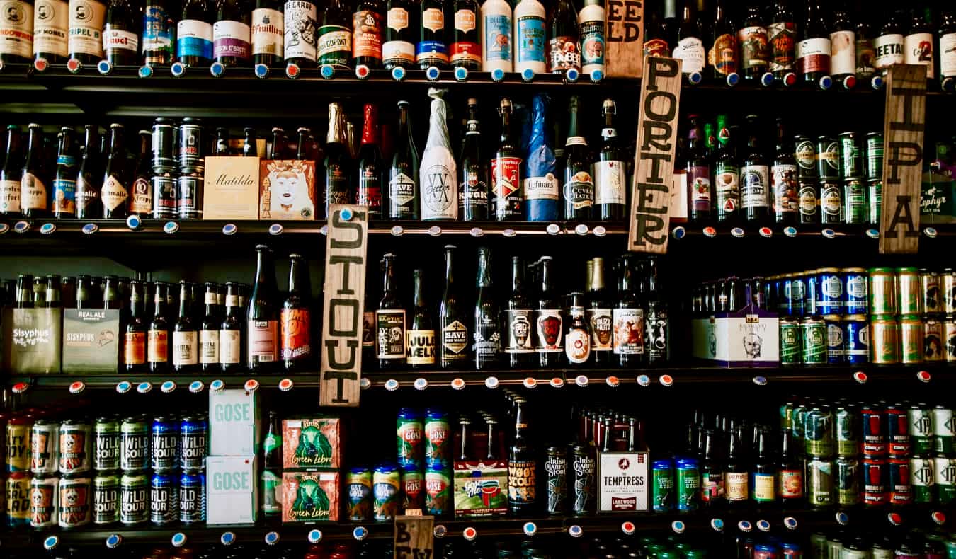 A wall of beers and alcoholic drinks at a bar in Austin, Texas