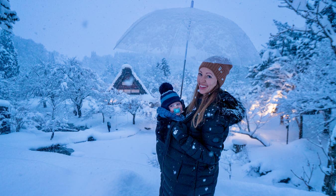 Blogger Kristin Addis traveling in snowy Japan with her young baby