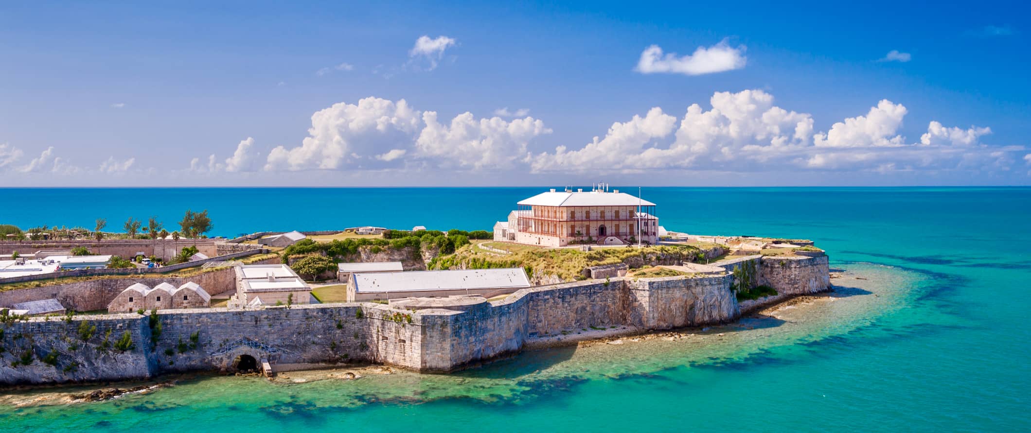 The historic Commissioner's House, surrounded by fortified walls in the Caribbean sea, on the island of Bermuda