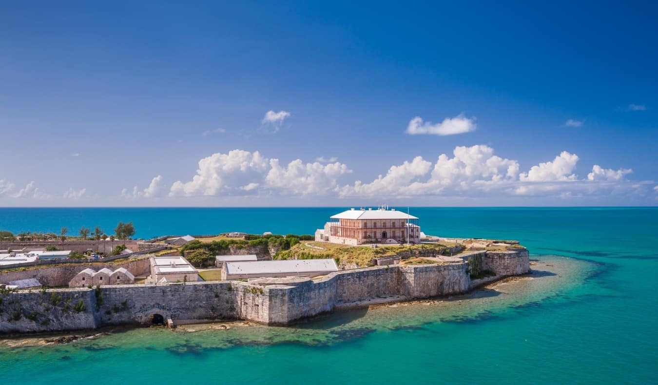 The historic Commissioner's House, surrounded by fortified walls in the Caribbean sea, on the island of Bermuda