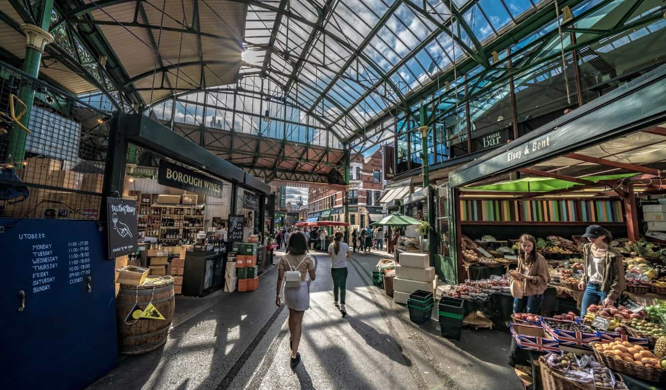 People walking through Borough Market in London, England