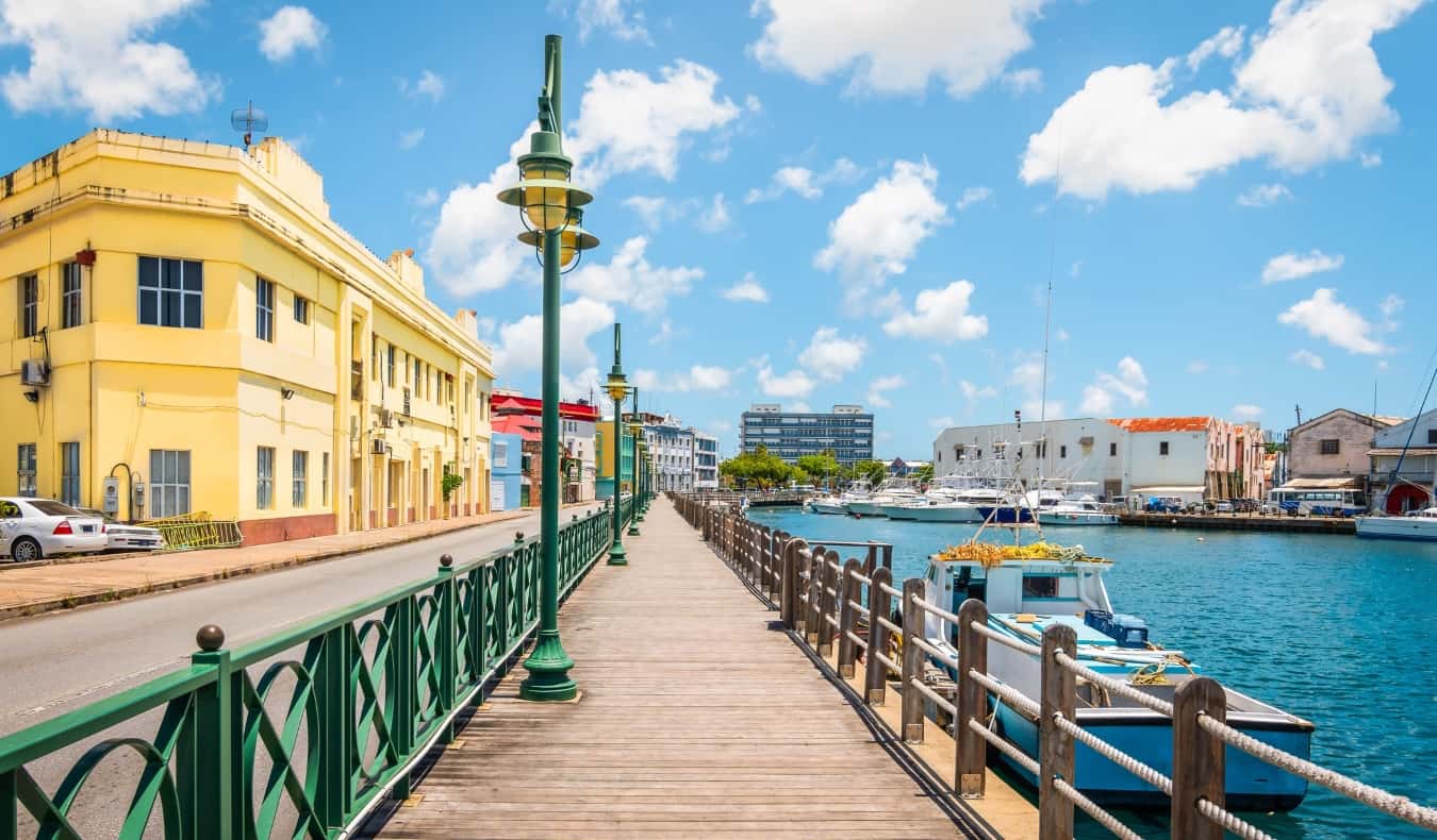 Bright image of wooden promenade at the waterfront of Bridgetown in Barbados.