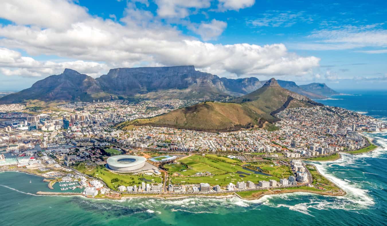 A view overlooking the city of Cape Town, South Africa on a bright and sunny day with mountains in the distance