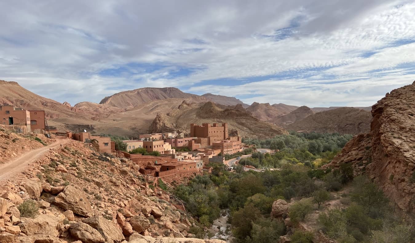 Rust red villages along a dusty road in Dades Valley, Morocco