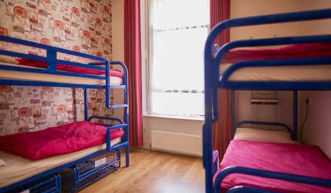 Old metal bunk beds in a dorm at Ashfield Hostel in Dublin, Ireland