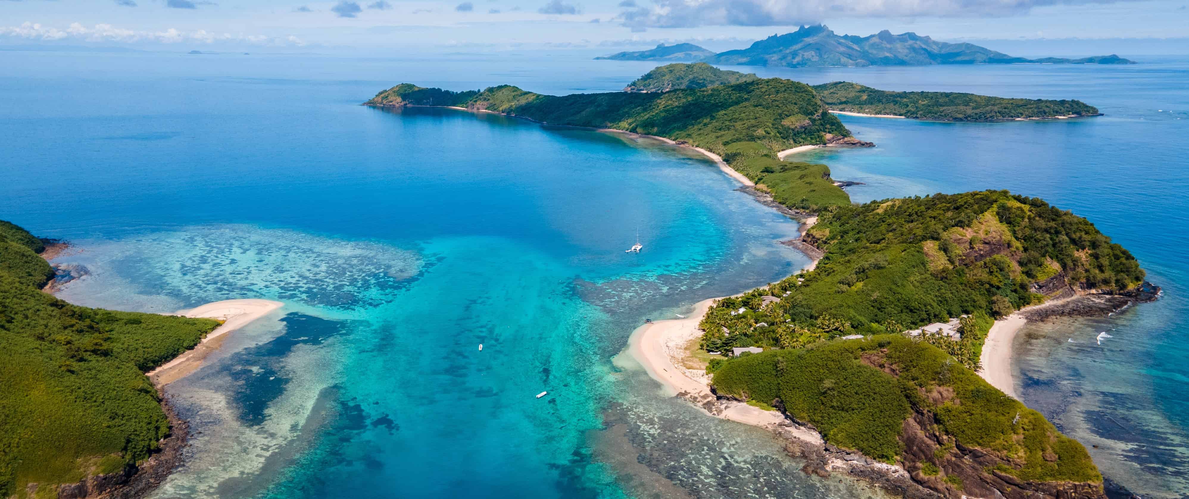 Remote islands surrounded by blue water in Fiji