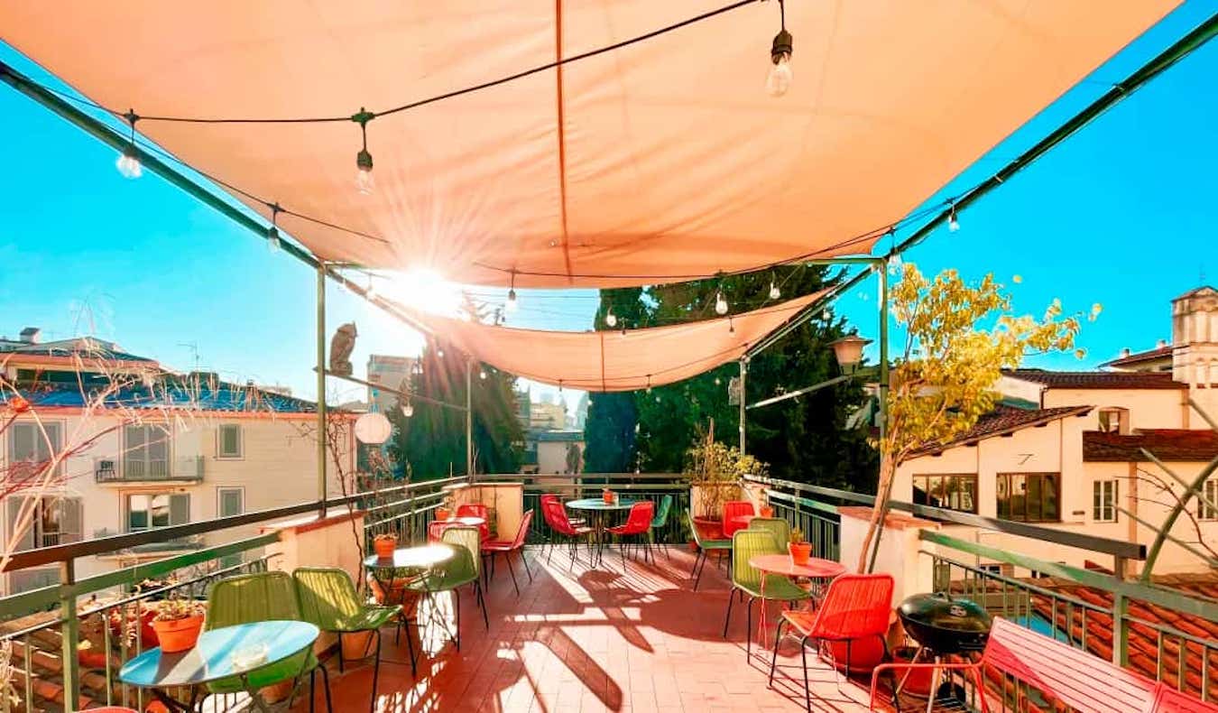 The cool rooftop terrace of the Ostello Bello Firenze hostel in Florence, Italy on a sunny day