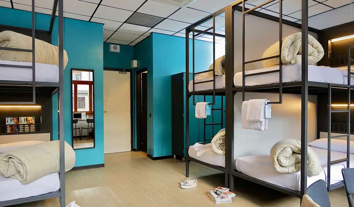 A spacious, clean dorm room in the PLUS Florence hostel in Florence, Italy