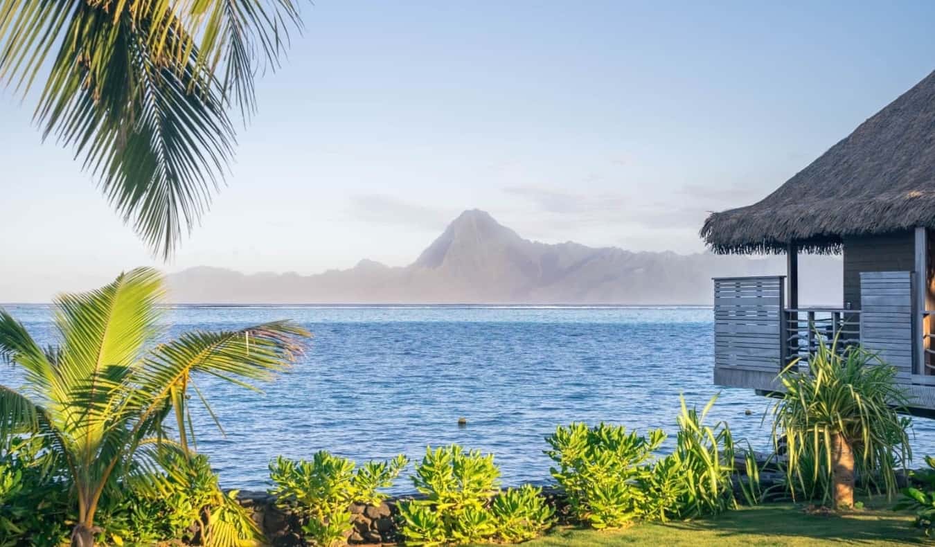 Thatched bungalow on the water in French Polynesia