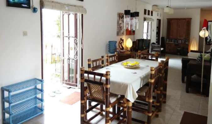 Kitchen area with traditional Balinese furnishings at Karma Backpacker hostel in Uluwatu, Bali