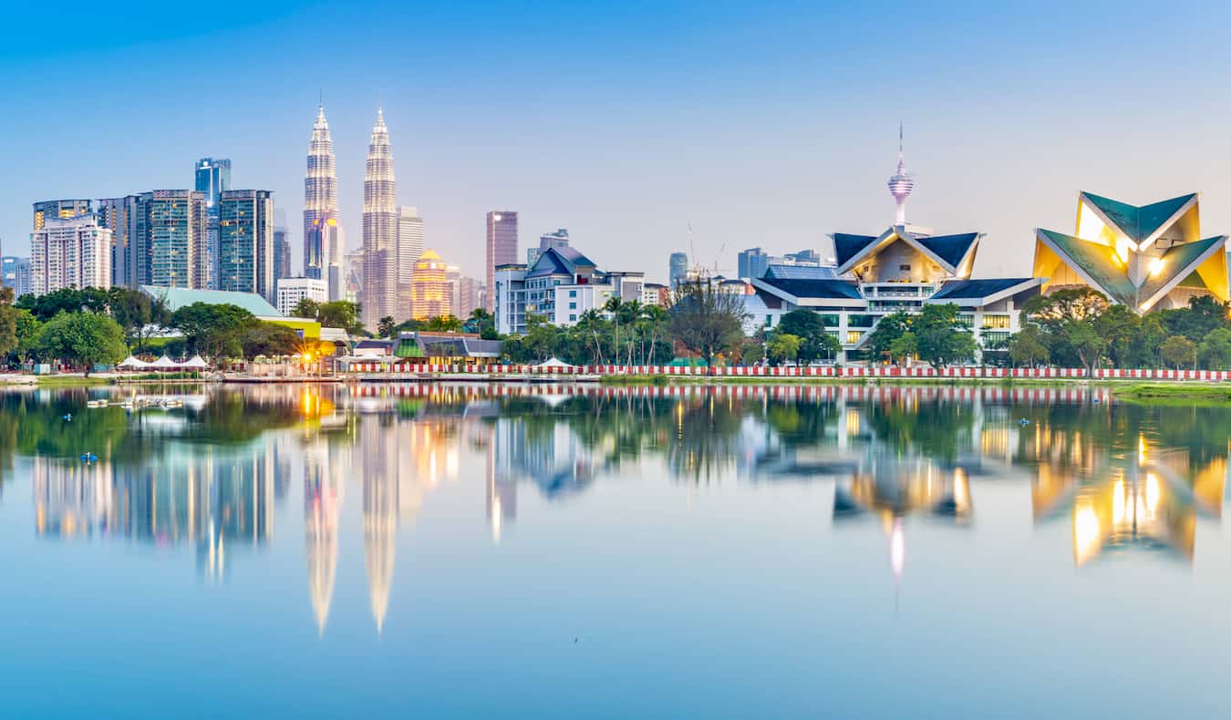 The view overlooking stunning Kuala Lumpur, Malaysia as seen from a nearby park with a lake