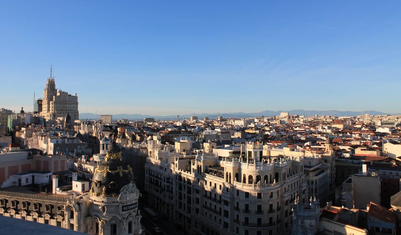 Views from the top of Circulo de Bellas Artes over the Madrid city skyline, with mountains in the background, in Madrid, Spain