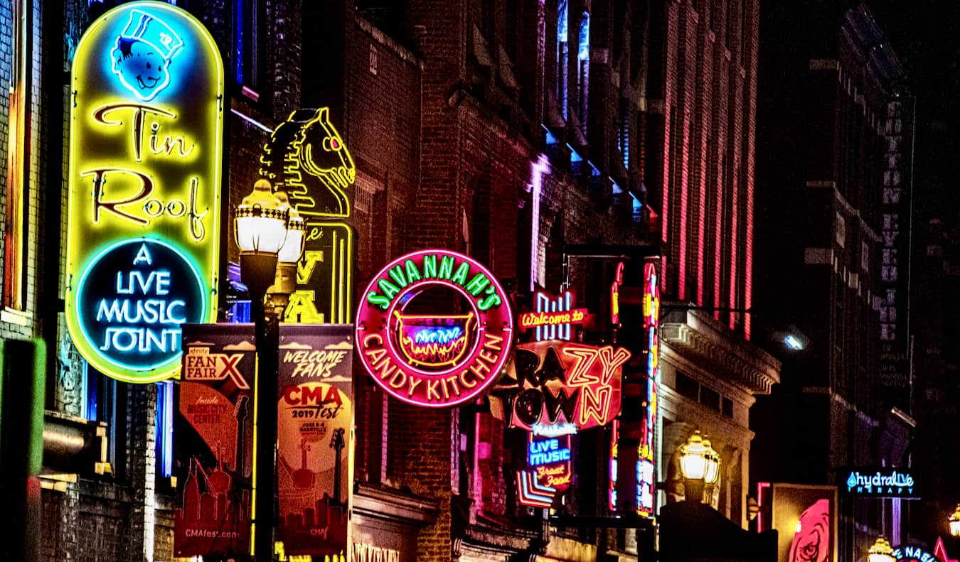 The bright lights of Honky Tonk Row in Nashville, TN illuminated at night