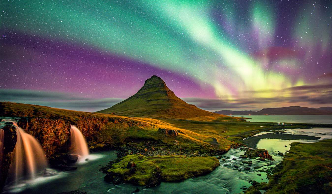 Kirkjufell mountain in Iceland under the Northern Lights