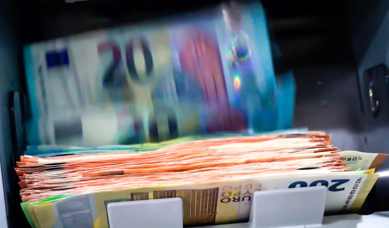 A huge wad of euros coming out of an ATM in Europe