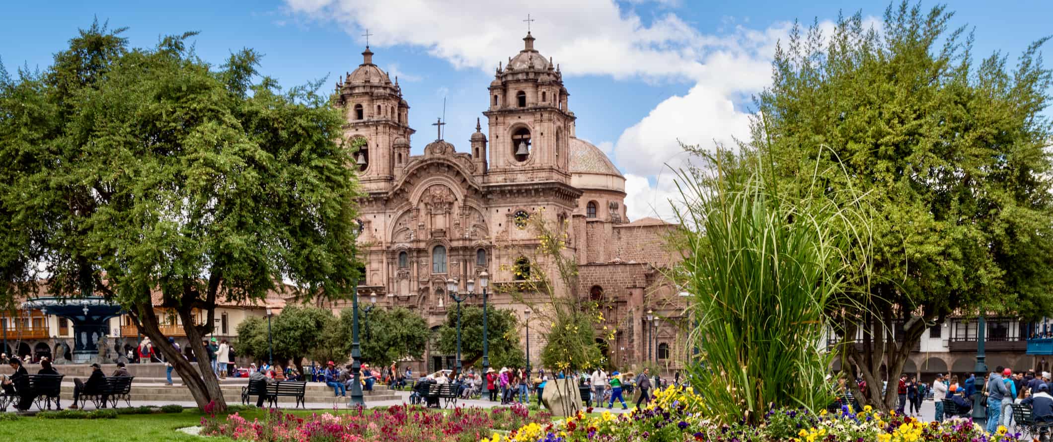 The historic square of Cusco, Pero full of flowers and travelers exploring the city