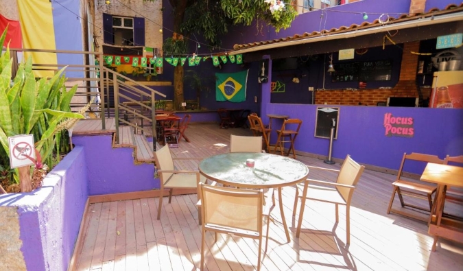 Colorful outdoor terrace and bar at Pura Vida Hostel in Rio de Janeiro, Brazil