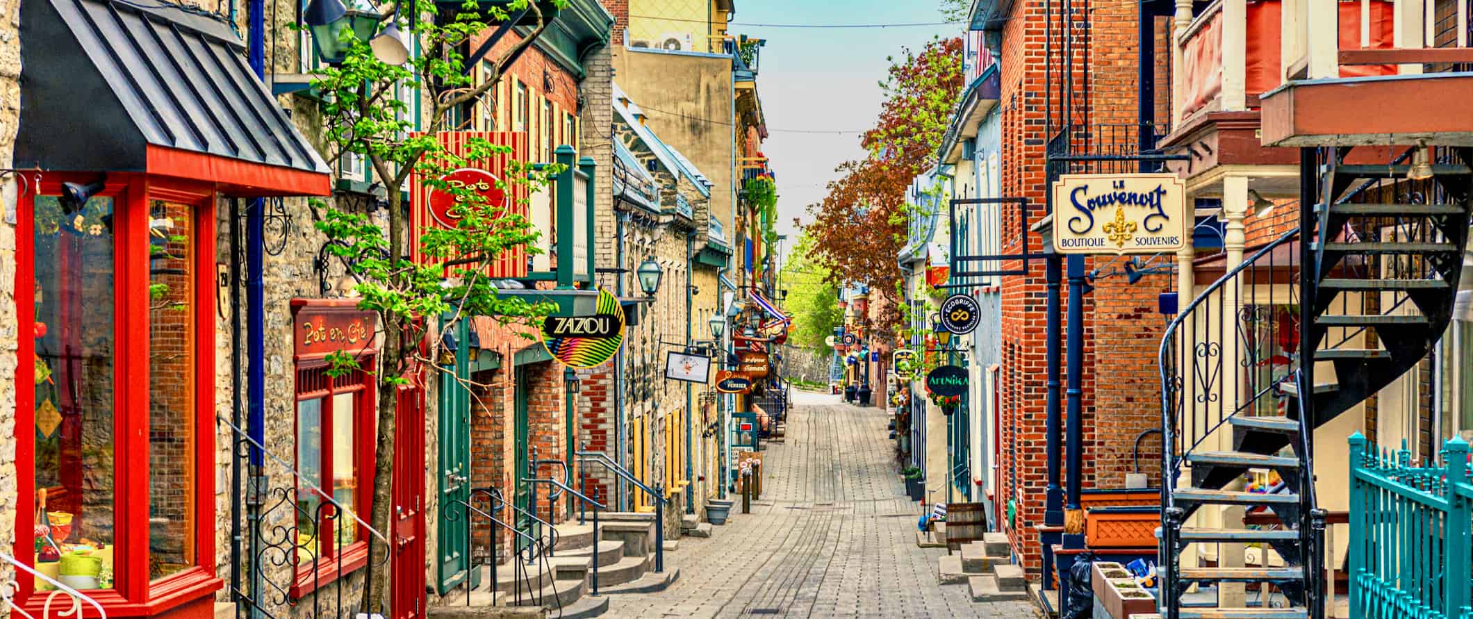 A narrow street lined by old shops in Quebec City, Canada