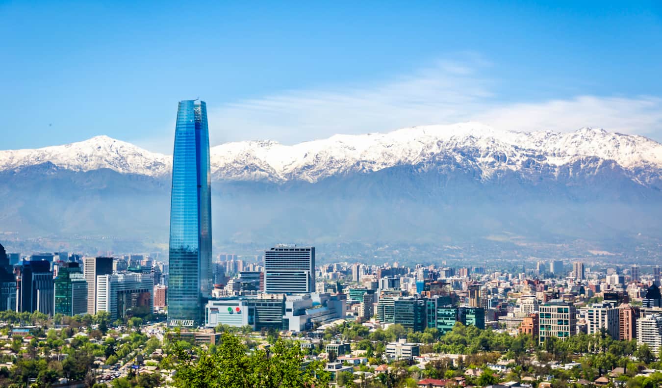 A sweeping view of Santiago, Chile with snowy mountains in the background