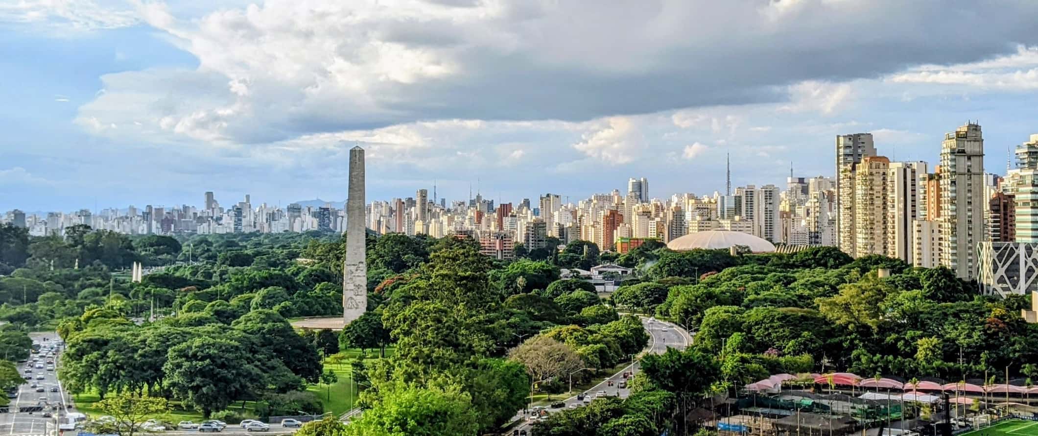 São Paulo ciy skyline with the obelisk and Ibirapuera Park in the foreground and the skyscrapers of the city in the background