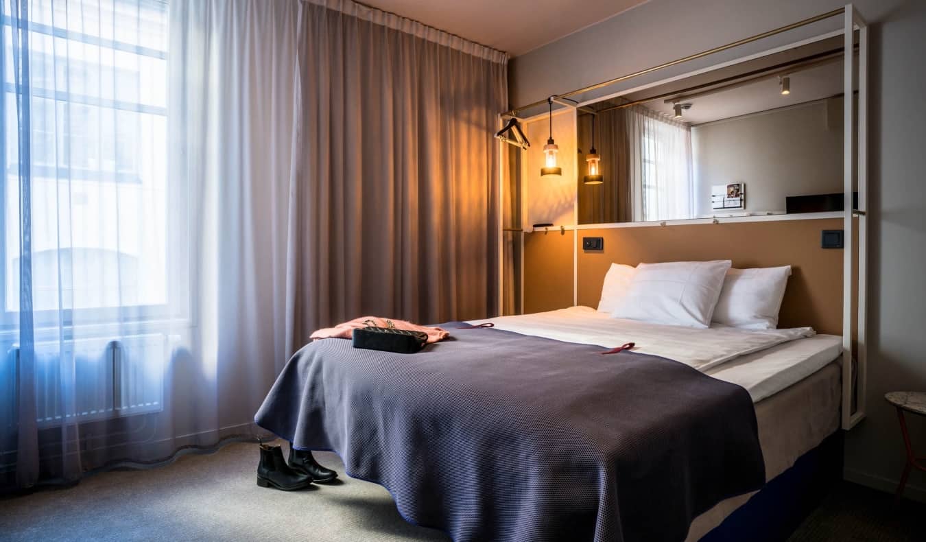 Simply decorated guestroom with a double bed at Scandic 53 hotel in Stockholm, Sweden