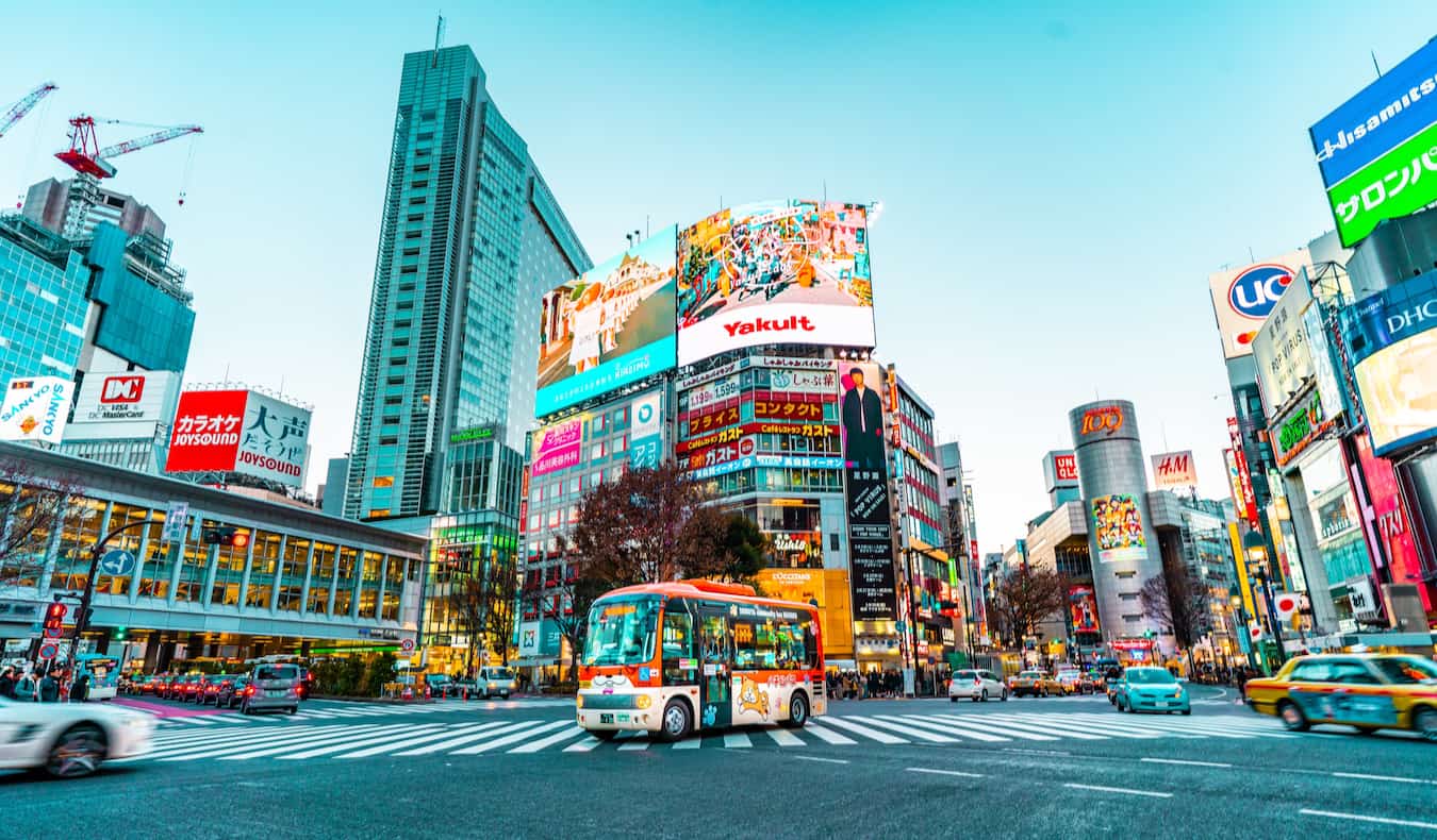 People crossing the street during busy traffic around the Shibuya area in Tokyo, Japan